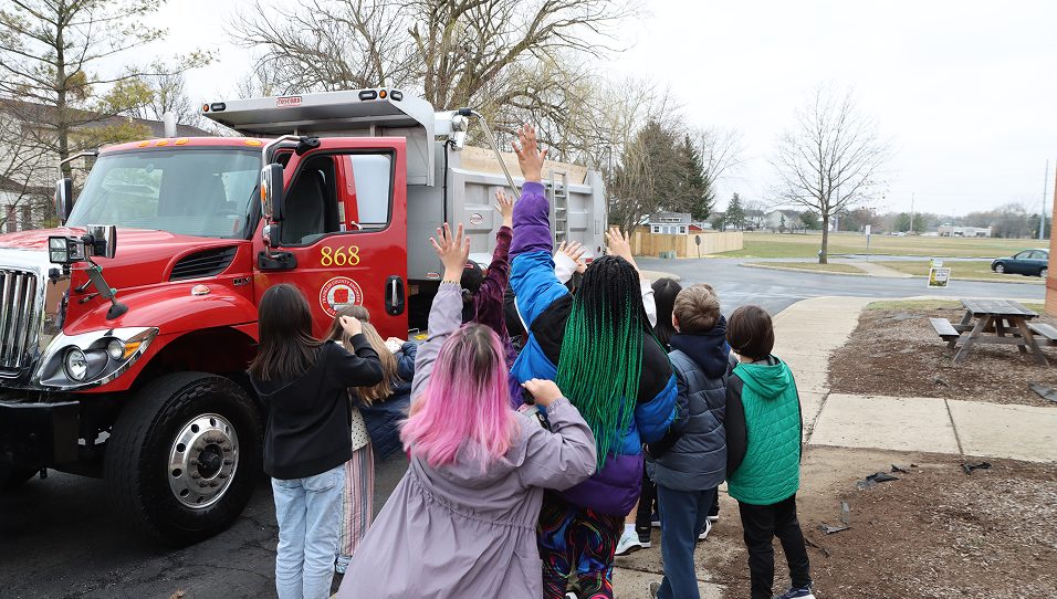 group of people in front of truck