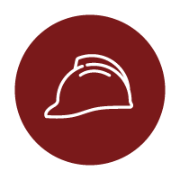 White outline of a construction hard hat centered on a dark red circular background, symbolizing safety or construction.